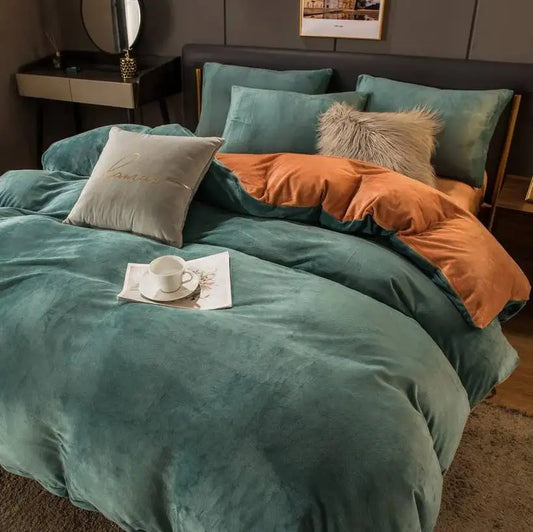 Bed with teal and orange bedding in a bedroom setting