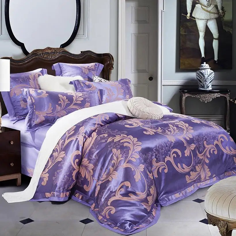 Purple floral patterned bedding set on a bed in a bedroom.