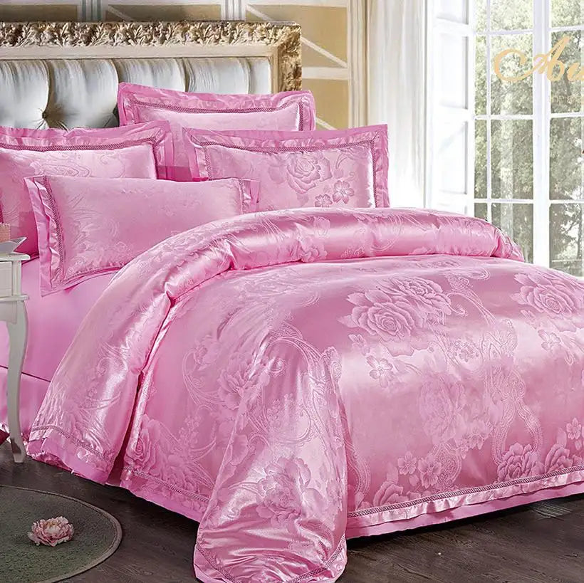 Pink floral bedding set on a bed in a well-lit room