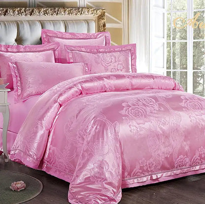 Pink floral bedding set on a bed in a well-lit room