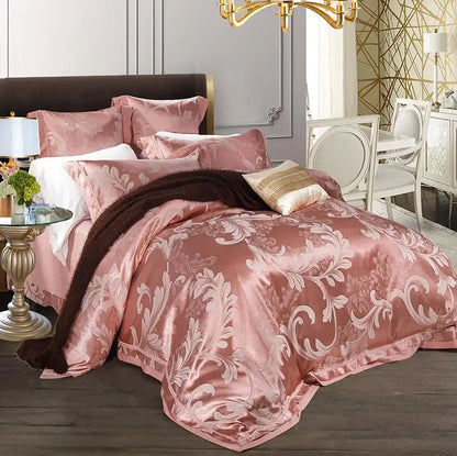 Pink floral patterned comforter on a bed in a stylish bedroom.