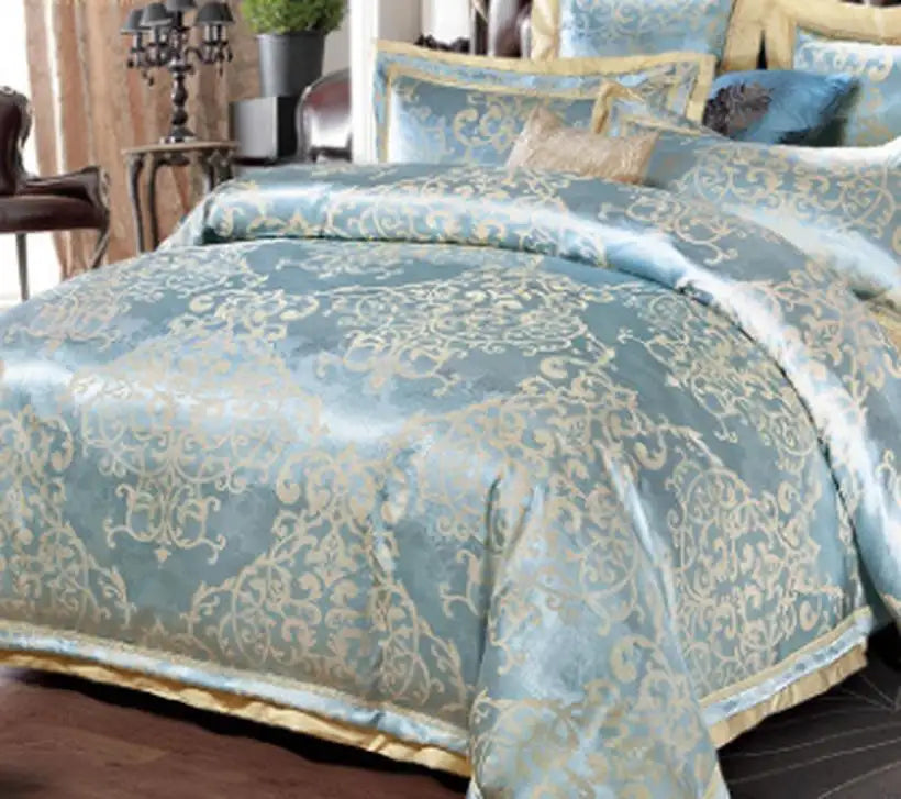 Blue and gold patterned bedding set on a bed in a bedroom setting.