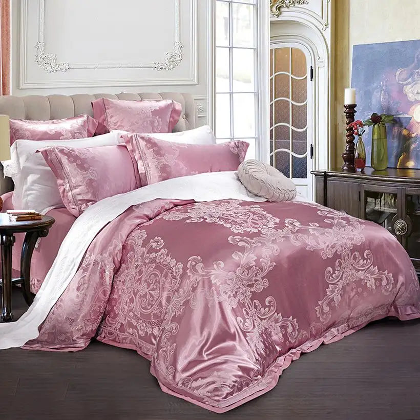 Pink patterned bedding set on a bed in a bedroom with decorative elements.