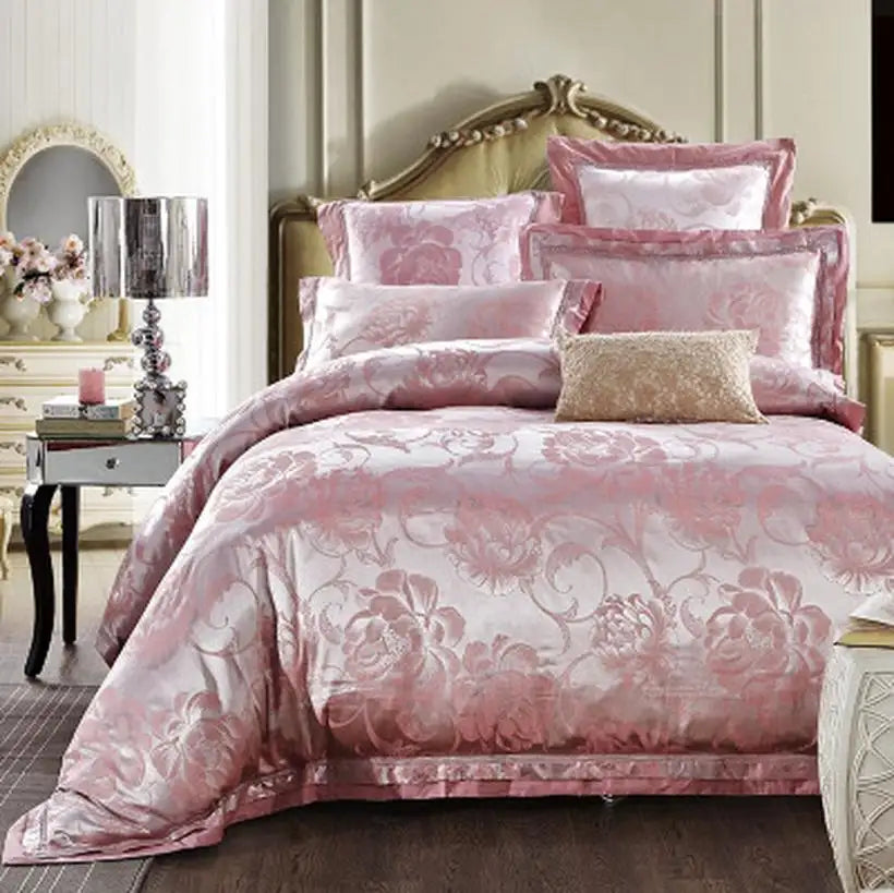 Pink floral bedding set on a bed in a bedroom setting