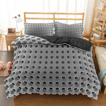 Gray textured comforter on a bed in a bedroom setting