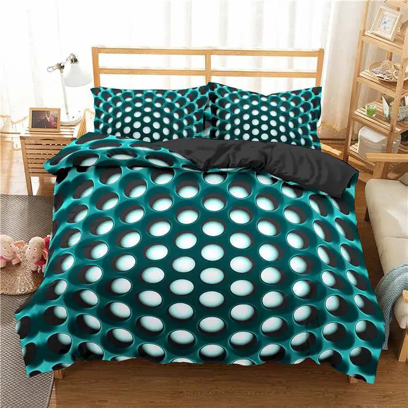 Teal and black polka dot bedding set on a bed in a bedroom.