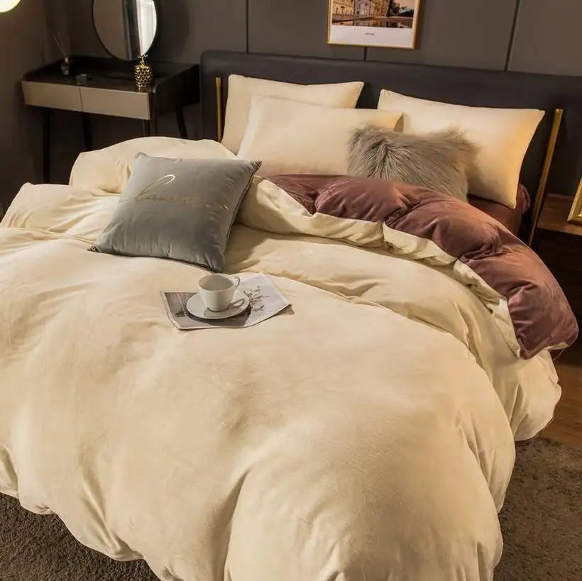 Neatly made bed with beige bedding and decorative pillows in a bedroom setting.