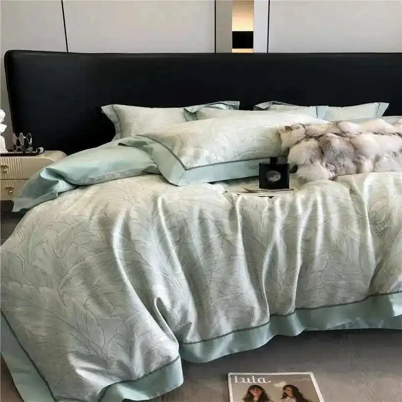 Bed with decorative bedding and a glass of wine on a tray.