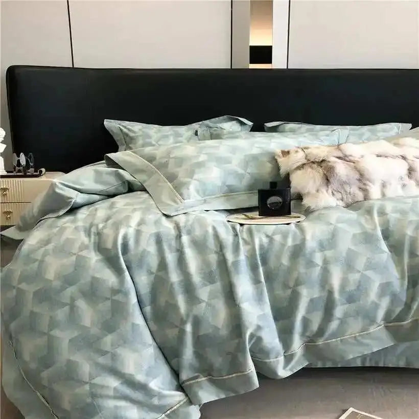 Bed with geometric patterned bedding in a bedroom setting