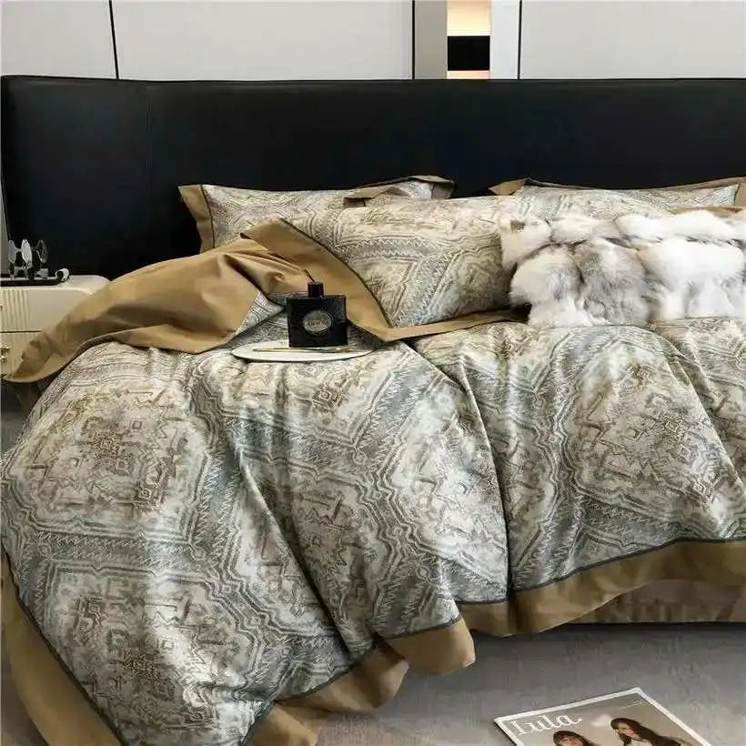 Patterned bedding set on a bed with a decorative headboard.