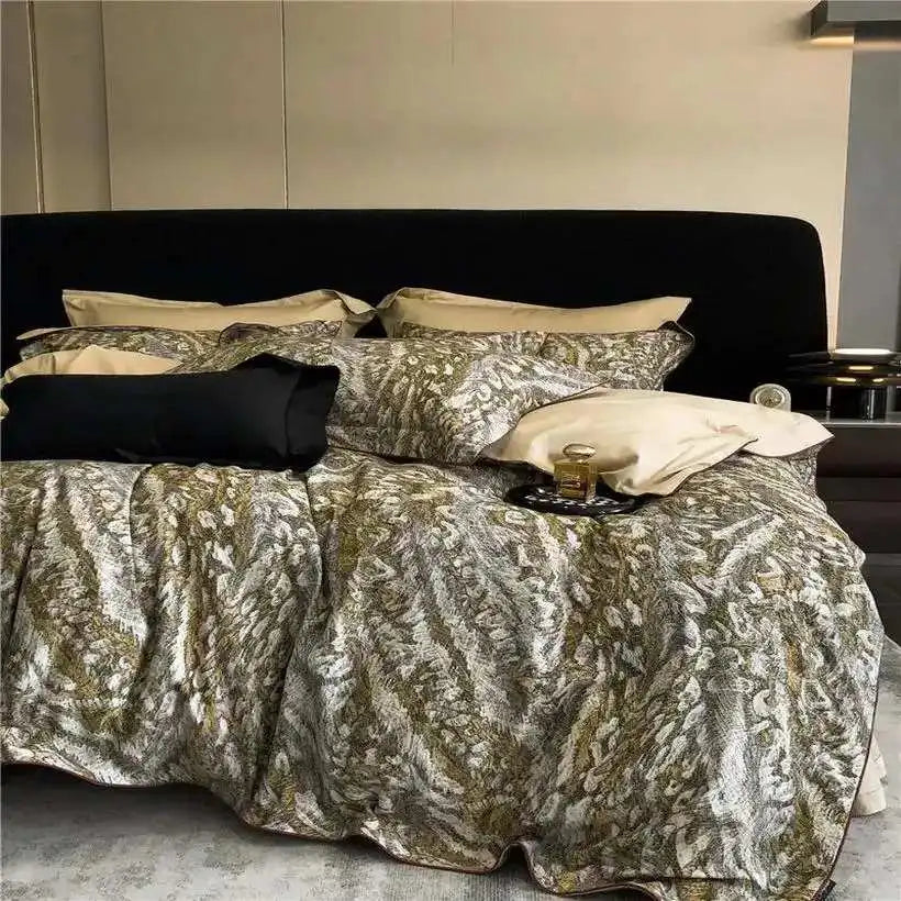 Bed with blue geometric patterned bedding and decorative pillows in a bedroom setting.