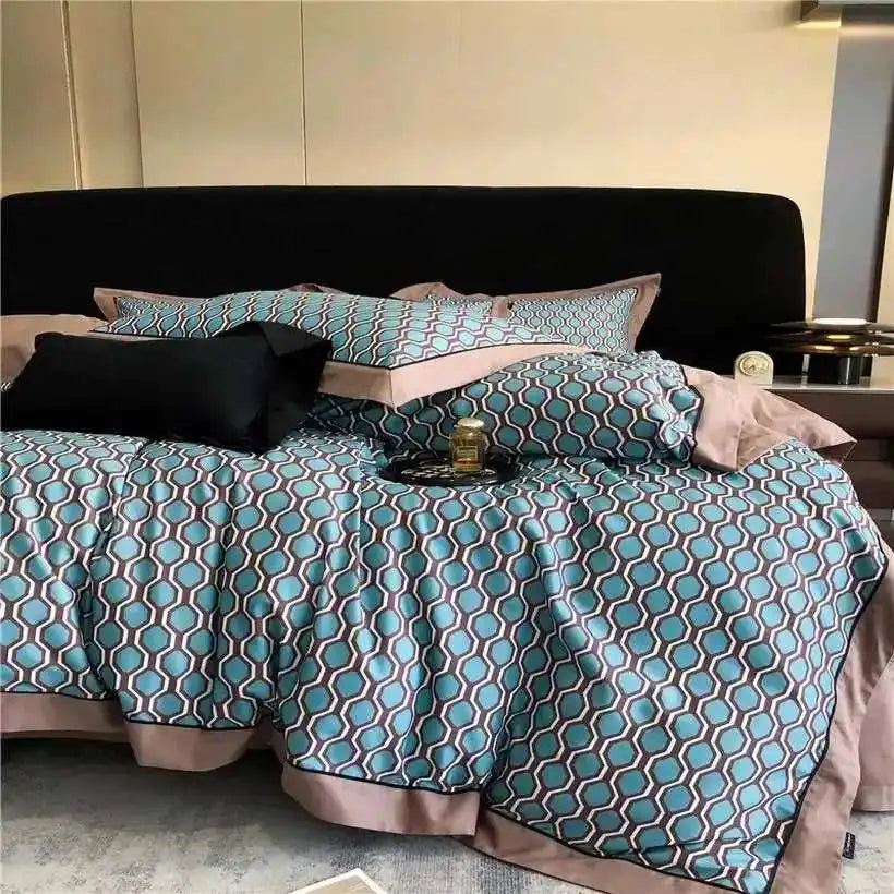 Decorative bedspread with paisley pattern on a bed in a bedroom setting.