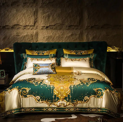 Luxurious bedroom with green and gold bedspread and pillows against a stone wall.