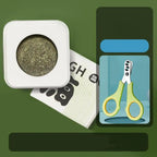 Square container with green substance, white card with black text, and small blue packaging with scissors on a green background. @chichicmart